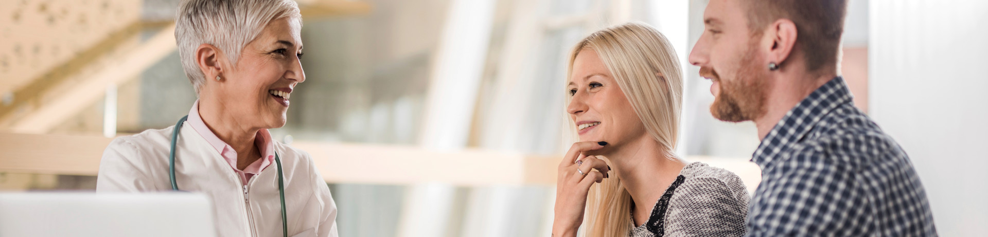 "nurse listening to patients heart"