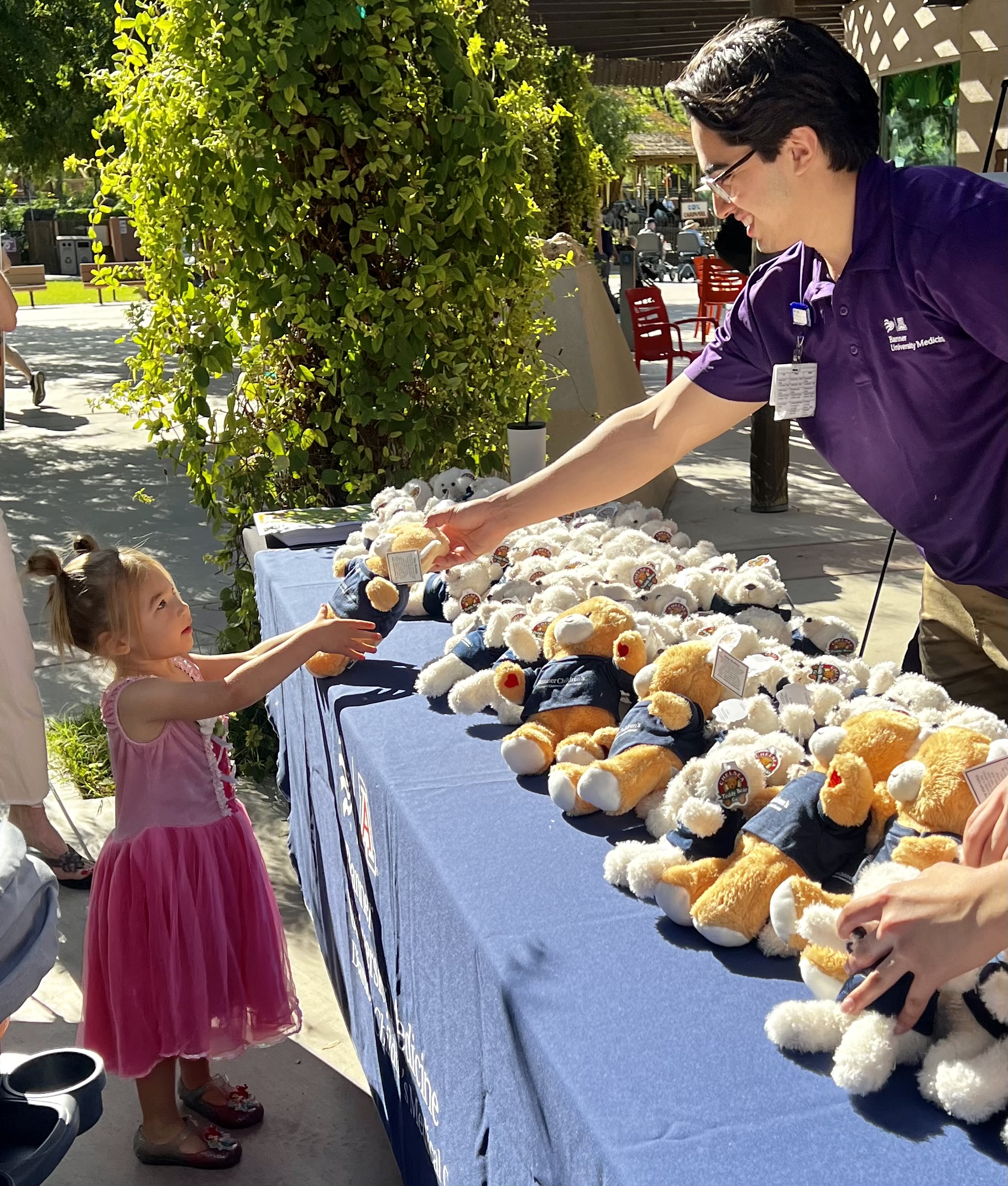 Teddy Bear Picnic handing out bear